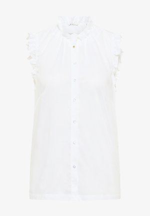 Witte mouwloze blouse met gerimpelde kraag en armsgaten, knoopsluiting aan de voorkant en een kleine gouden knoop bij de halslijn.