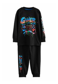 Schwarzes Kinder-Loungewear-Set bestehend aus einem langärmligen Oberteil mit einem auffälligen "GAMER"-Grafikdesign und Controller-Motiv, kombiniert mit passenden Hosen.