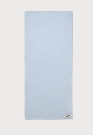 Écharpe tricotée rectangulaire bleu clair avec une petite étiquette blanche indiquant "DRYKORN" cousue près d’un coin sur fond blanc.