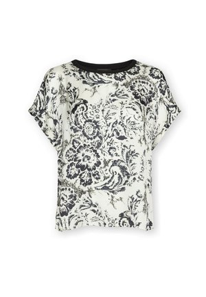 Biała bluzka z krótkim rękawem z czarnym kwiatowym i spiralnym wzorem, okrągły czarny dekolt, luźny krój.