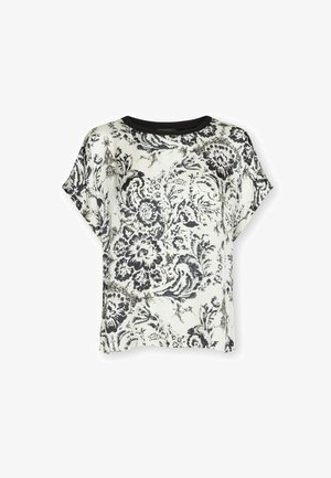 Biała bluzka z krótkim rękawem z czarnym kwiatowym i spiralnym wzorem, okrągły czarny dekolt, luźny krój.