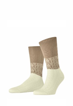 Par midt på læggen sokker med struktureret strikket design, cremefarvet på foden og beige med mønster på manchet og øverste del.