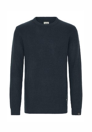 Dark blue ribbed knit sweater with a round neckline, long sleeves, and a small logo tag on the lower side. Soft texture and fitted design.