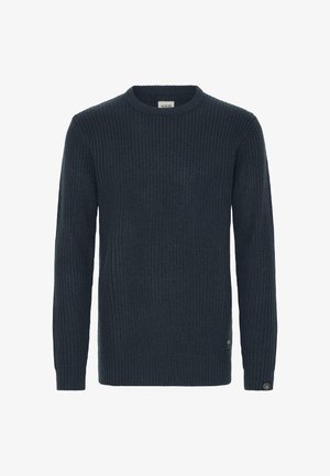 Dark blue ribbed knit sweater with a round neckline, long sleeves, and a small logo tag on the lower side. Soft texture and fitted design.