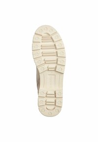 Semelle en caoutchouc crème avec des crampons profonds pour une traction, portant le texte "SOLIVER" et la taille "37" gravés au bas.