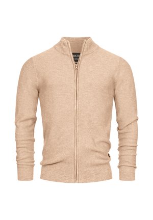 Beige zip-up cardigan med lange ærmer, høj krave, ribbede manchetter og kant, tekstureret strikket mønster. Diskret logo detalje nær kanten.