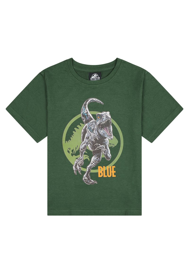 Camiseta de algodón verde con un gráfico de un dinosaurio y el texto "AZUL", sobre un diseño circular en verde más claro.