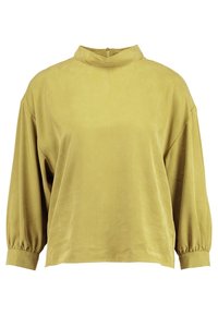 Blouse jaune moutarde à manches longues avec col montant, poignets froncés et fermeture éclair au dos.