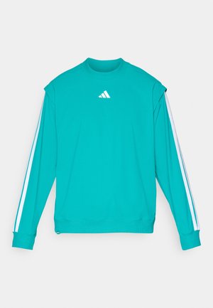 Turkusowa sportowa bluza z długim rękawem, z białymi paskami na rękawach i małym białym logo Adidasa na piersi.
