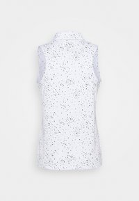 Haut blanc sans manches avec motif de points noirs dispersés et col, vu de dos sur un fond uni.