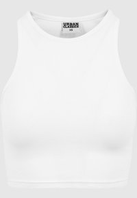 Débardeur court blanc à côtes en tissu extensible. Il présente un col rond et une conception sans manches avec un ourlet droit. Étiquette de marque visible.