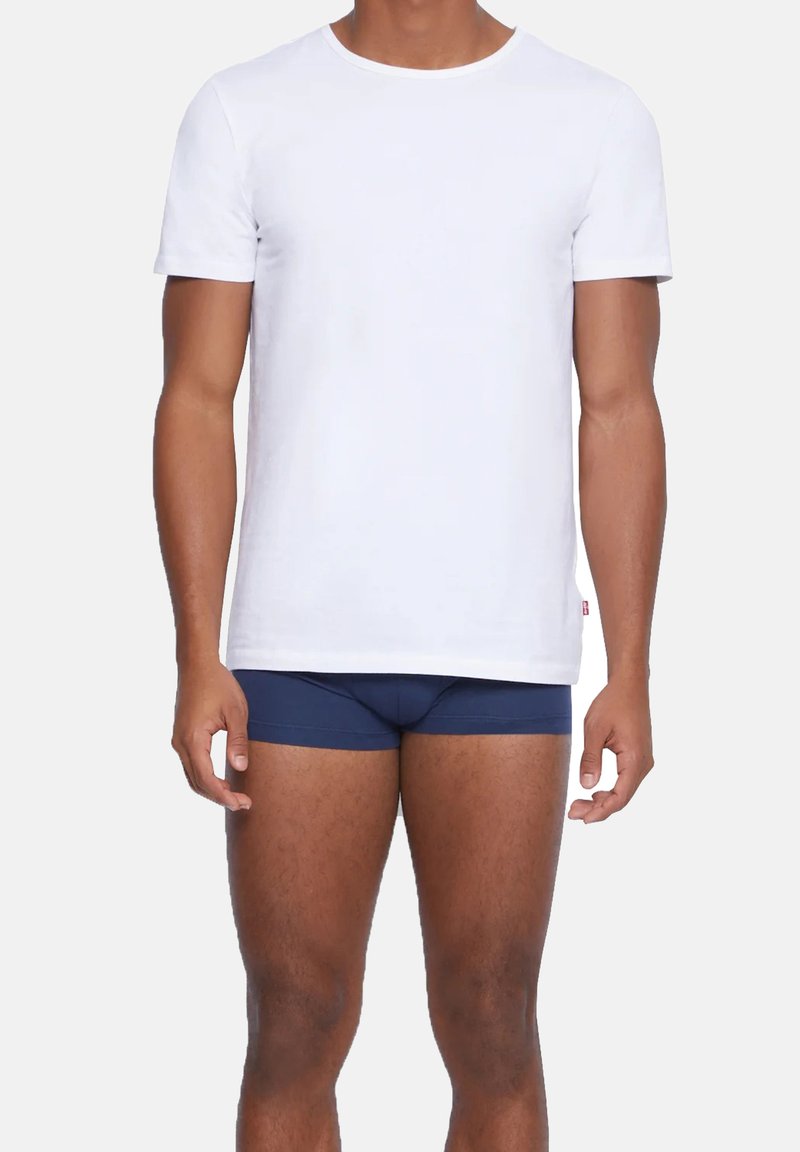 White cotton t-shirt with short sleeves and a round neck, paired with navy blue boxer briefs. Simple, classic fit design.