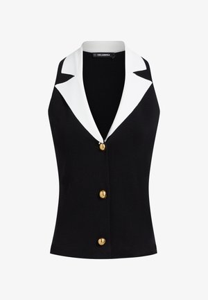 Črni brezrokavnik z širokimi belimi reverji in tremi zlatimi gumbi spredaj, z oznako Karl Lagerfeld na notranji strani ovratnika.