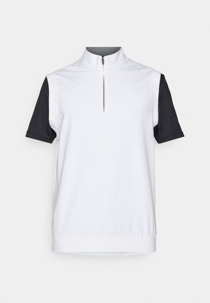 Short-sleeve polo with a white body and black sleeves, featuring a zippered collar and smooth, lightweight fabric.
