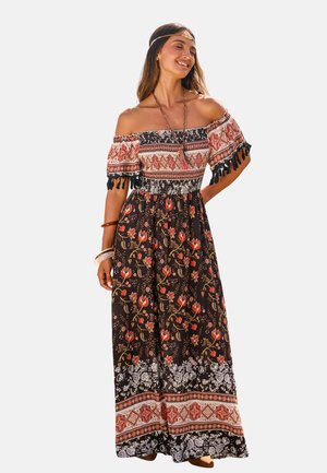 Abito maxi con maniche scoperte, fondo nero, motivi floreali colorati e rifiniture decorative. Tessuto testurizzato con dettagli a nappe.