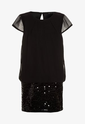 Zwarte jurk met een doorzichtige overlay met korte mouwen en een onderste helft bedekt met pailletten. Heeft een hoge halslijn en een keyhole detail op de achterkant.