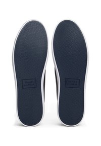 Paire de semelles de chaussures bleu marine avec motif texturé et logo Tommy Hilfiger embossé au centre de chaque semelle.
