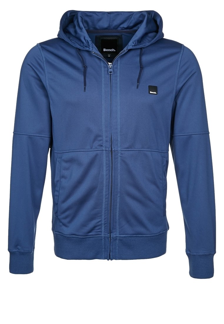 Navy zip-up hoodie with a drawstring hood, two side pockets, ribbed cuffs, smooth fabric, and a small logo on the chest.