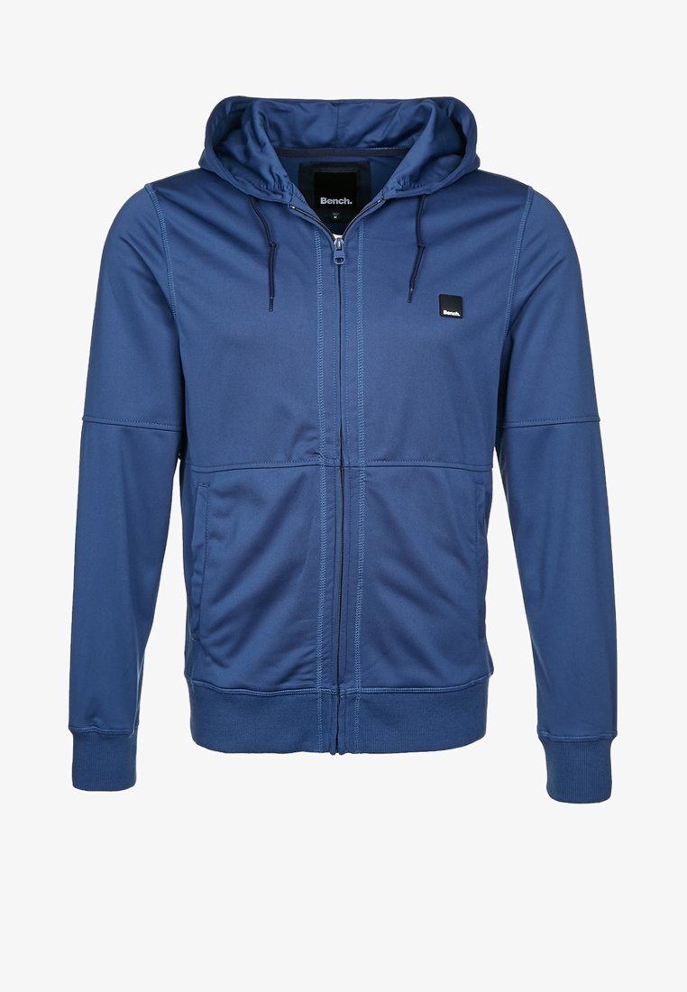 Námořnická mikina na zip s kapucí se stahovací šňůrkou, dvěma postranními kapsami, žebrovanými manžetami, hladkým materiálem a malým logem na prsou.