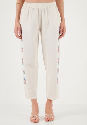 REGULAR FIT - Trousers - beige orange