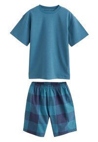 Cotton T-shirt in teal paired with elastic-waist shorts featuring a blue checkered pattern. Both pieces have a relaxed design.