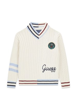 Jersey de punto color crema con escote en V, a rayas en azul, negro y rojo, con un parche circular y "Guess" bordado en el frente.