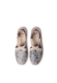 Gray and beige espadrilles with a textured upper, cross-strap design, and a jute sole. Features a subtle pattern on the fabric.
