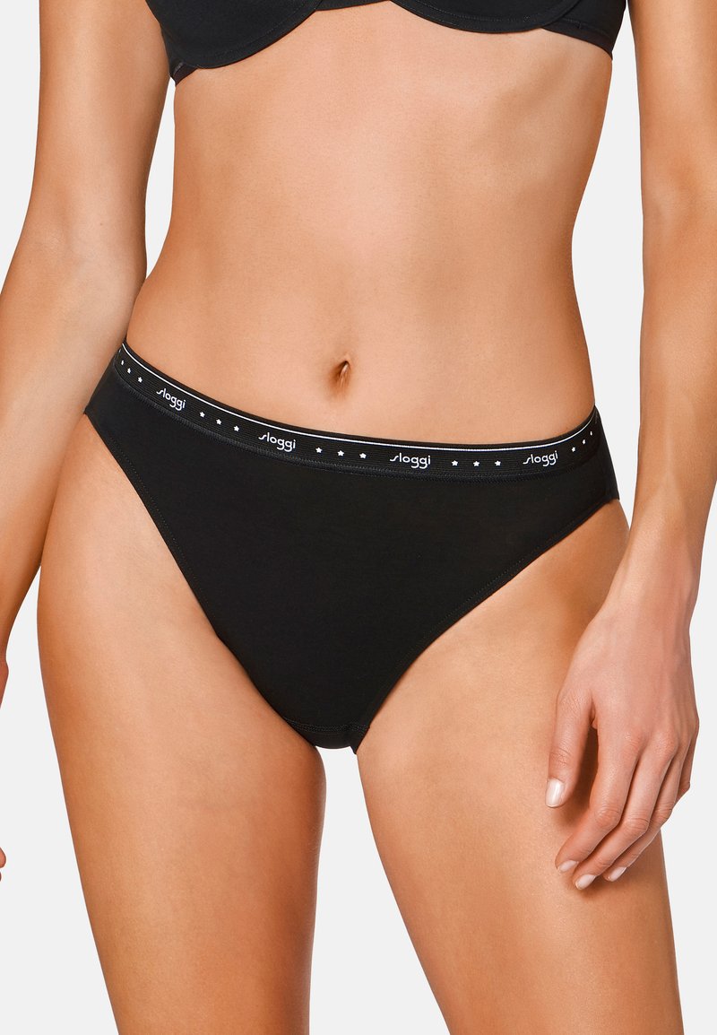 Schwarze Baumwoll-Bikiniunterhose mit schmalem Bund und dekorativen weißen Punkten. Glatte Textur mit klassischem Schnitt und minimalistischen Nähten.