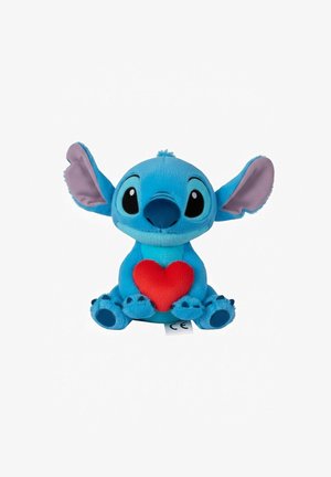 Giocattolo di peluche a forma di alieno dei cartoni animati. Di un azzurro brillante con una toppa a forma di cuore rossa, grandi orecchie, occhi rotondi neri e zampe con dettagli a contrasto.