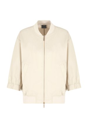 Giacca bomber beige chiaro con zip frontale, polsini elasticizzati, tasche laterali e orlo a coste. Tessuto liscio e durevole con una vestibilità rilassata.