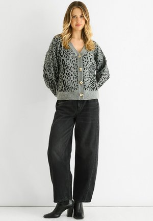 Gray cardigan with black leopard print, V-neck, and five gold buttons at the front. Paired with black jeans and ankle boots.