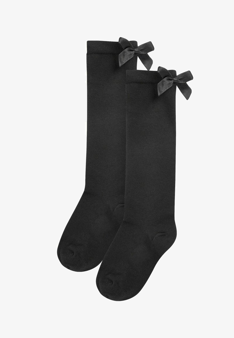 Black knee-high socks made of a soft, smooth fabric featuring decorative black satin bows at the top of each sock.