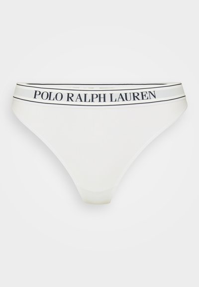 Balta kokvilnas bikšu siksna ar melnbaltu svītrainu jostu, uz kuras ir "POLO RALPH LAUREN" logo. Gluda tekstūra, minimālistisks dizains.