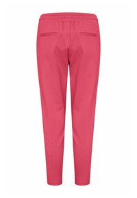 Jogger rosa attillati con vita elastica, dotati di due tasche posteriori. Realizzati in un materiale morbido e elastico con una texture liscia.