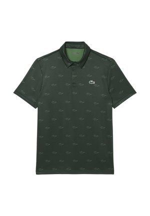 Polo shirt verde scuro con un sottile motivo all-over del logo Lacoste, maniche corte e colletto classico. Realizzato in tessuto liscio e traspirante.