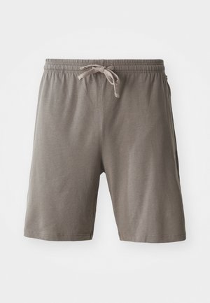 Bruna shorts i mjukt tyg, med elastisk midja och justerbar dragsko, samt sidfickor. Slät textur utan mönster.