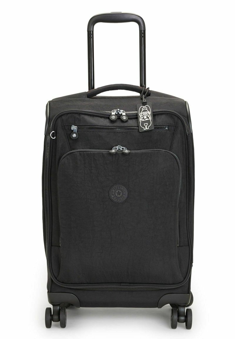 Black wheeled suitcase with a textured surface, dual zippered front pocket, and a retractable handle. Features four rolling wheels and a tag.