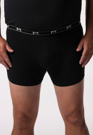 Boxer da uomo neri con una texture morbida, dotati di una vita comoda con logo. Progettati per una vestibilità aderente.
