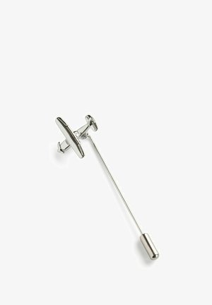 Sølv metal slipselse med en flad, forlænget top og en lige, tynd skaft. Har en rund afslutning for sikker fastgørelse.