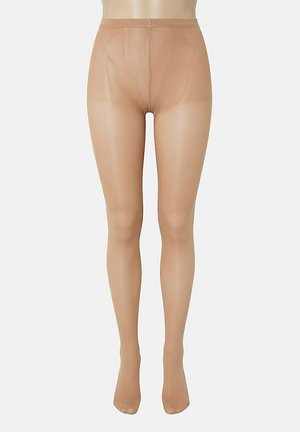 Collants transparents couleur nude présentés sur un mannequin de la taille jusqu'aux orteils, sur un fond blanc uni.