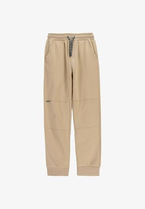 Beżowe spodnie dresowe z elastycznym pasem, czarno-białym ściągaczem, bocznymi kieszeniami, prążkowanymi mankietami i przeszyciami na kolanach.