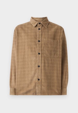 Brown corduroy shirt with long sleeves, classic collar, button closure, single chest pocket, and subtle texture, featuring black buttons.