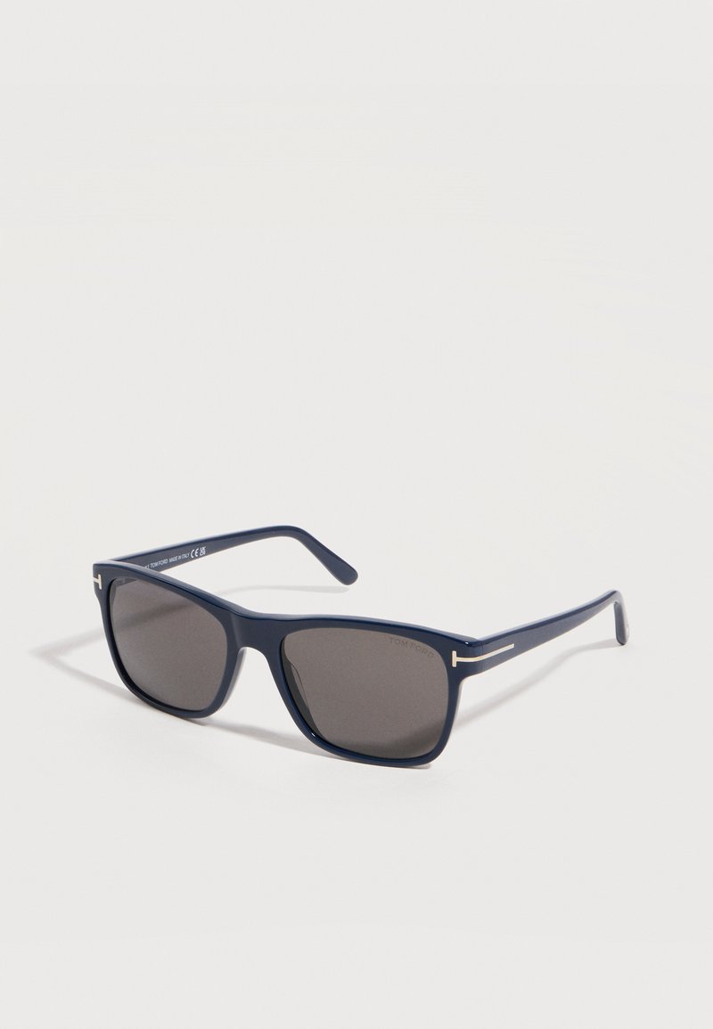 Rectangular navy blue sunglasses with dark tinted lenses and slim arms featuring a small silver accent near the hinges.
