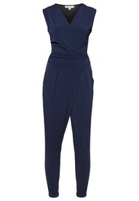 Combinaison bleu marine sans manches avec col en V, taille froncée et jambes fuselées.