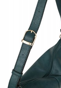 Cinghia a spalla in pelle teal con fibbia metallica dorata, dotata di una finitura testurizzata e un design regolabile.