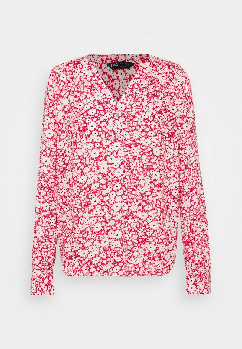 Blusa a maniche lunghe con motivo floreale. Presenta una combinazione di colori rosso e bianco con piccoli fiori e una scollatura a V. Tessuto leggero.