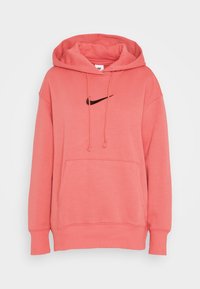 Korallrosa huvtröja med framficka, snörning i huvan, ribbade muddar och svart Nike swoosh-logotyp på bröstet.