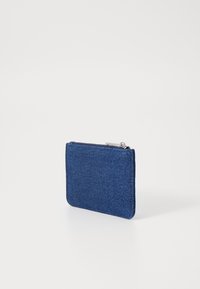 Blue denim wallet, rectangular shape, zip closure on top, textured surface, subtle sheen, small size for cards and cash.