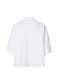 Vue arrière d'une chemise blanche unie à manches courtes, avec col et coupe ample.