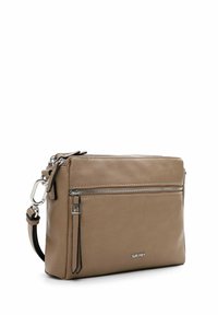 Tan leather crossbody bag with zipper compartments, silver hardware, and a detachable strap. Smooth texture and minimalist design.